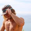 man-wearing-wesc-aztec-camper-hat-outside-and-shirtless